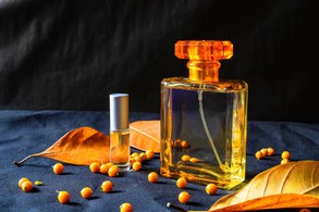 gold-perfume-bottle-and-orange-leaves-free-photo gold-perfume-bottle-and-orange-leaves-free-photo